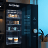 Atlantis Coffee Vending Machine Delhi with multiple coffee options displayed behind glass door