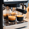 Close-up of espresso shots being brewed from Alaska coffee machine showcasing Alaska coffee machine price importance