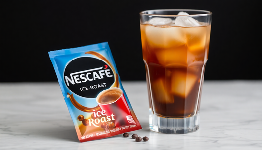 A Nescafe Ice Roast sachet beside a glass of iced coffee