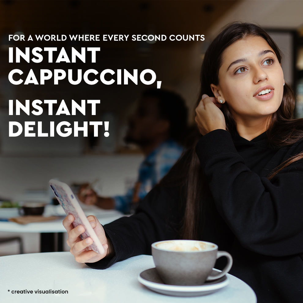 Woman sitting at a table with a cup of cappuccino and a phone advertising 3in1 cappuccino coffee premix