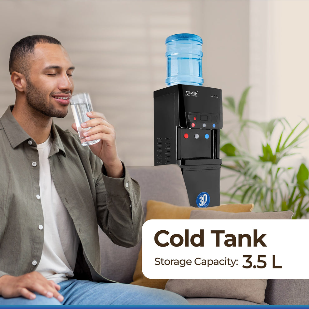Man enjoying a glass of water next to an Atlantis Blaque water dispenser with 3.5L cold tank capacity