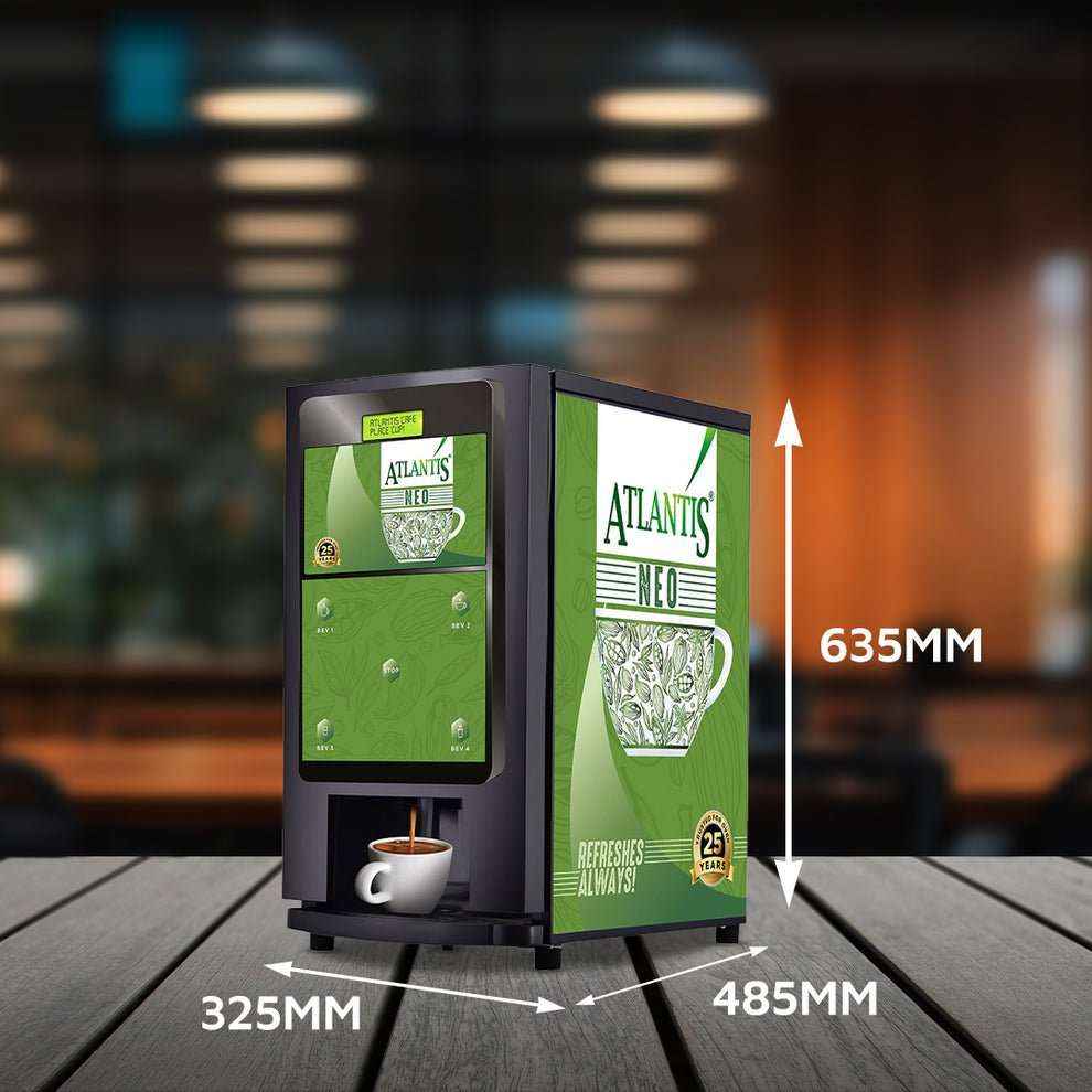 Compact coin operated coffee vending machine with Atlantis Neo branding and size dimensions in a cafe setting