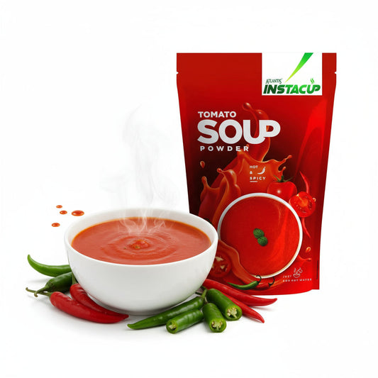 ATLANTIS SOUP PREMIX 500 gm tomato soup powder with hot and spicy flavour served in a white bowl with fresh red and green chillies
