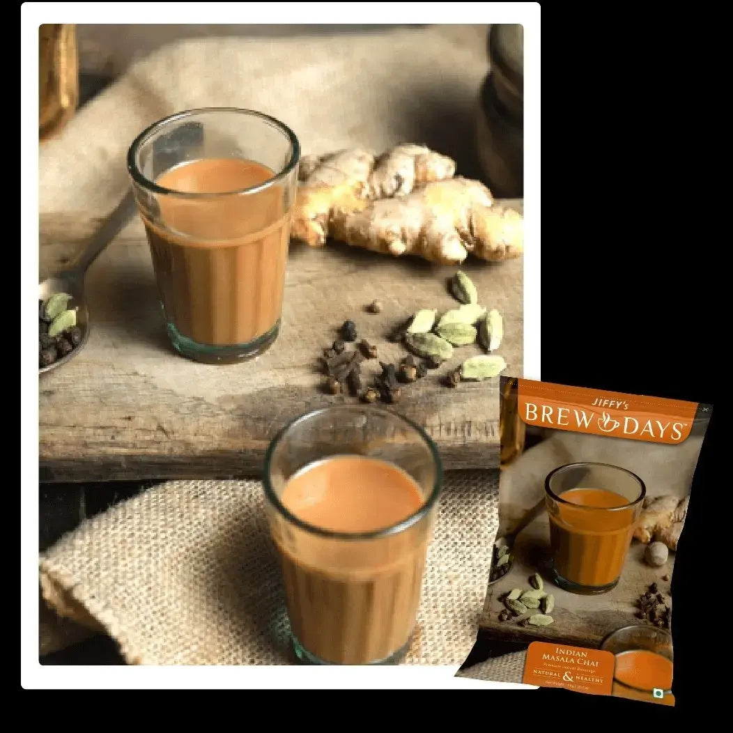 Two glasses of Indian masala tea premix with ginger and spices on wooden surface and packaging