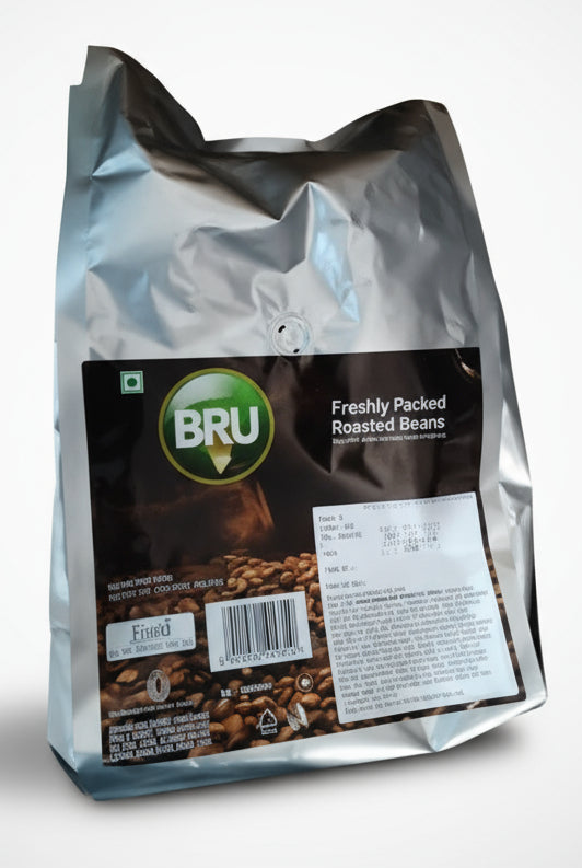 Silver pouch of Bru coffee beans 1kg price with freshly packed roasted beans label