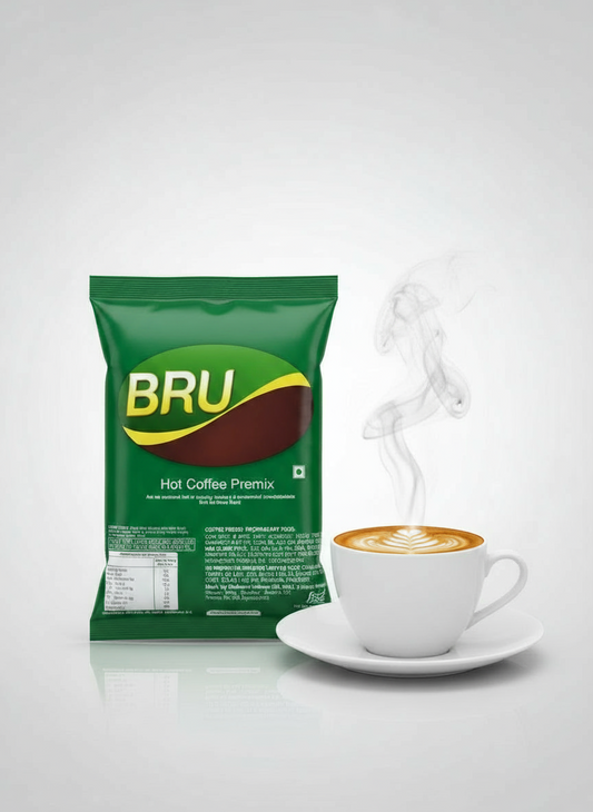 Bru coffee premix 1kg green pack with a steaming cup of hot coffee on white saucer