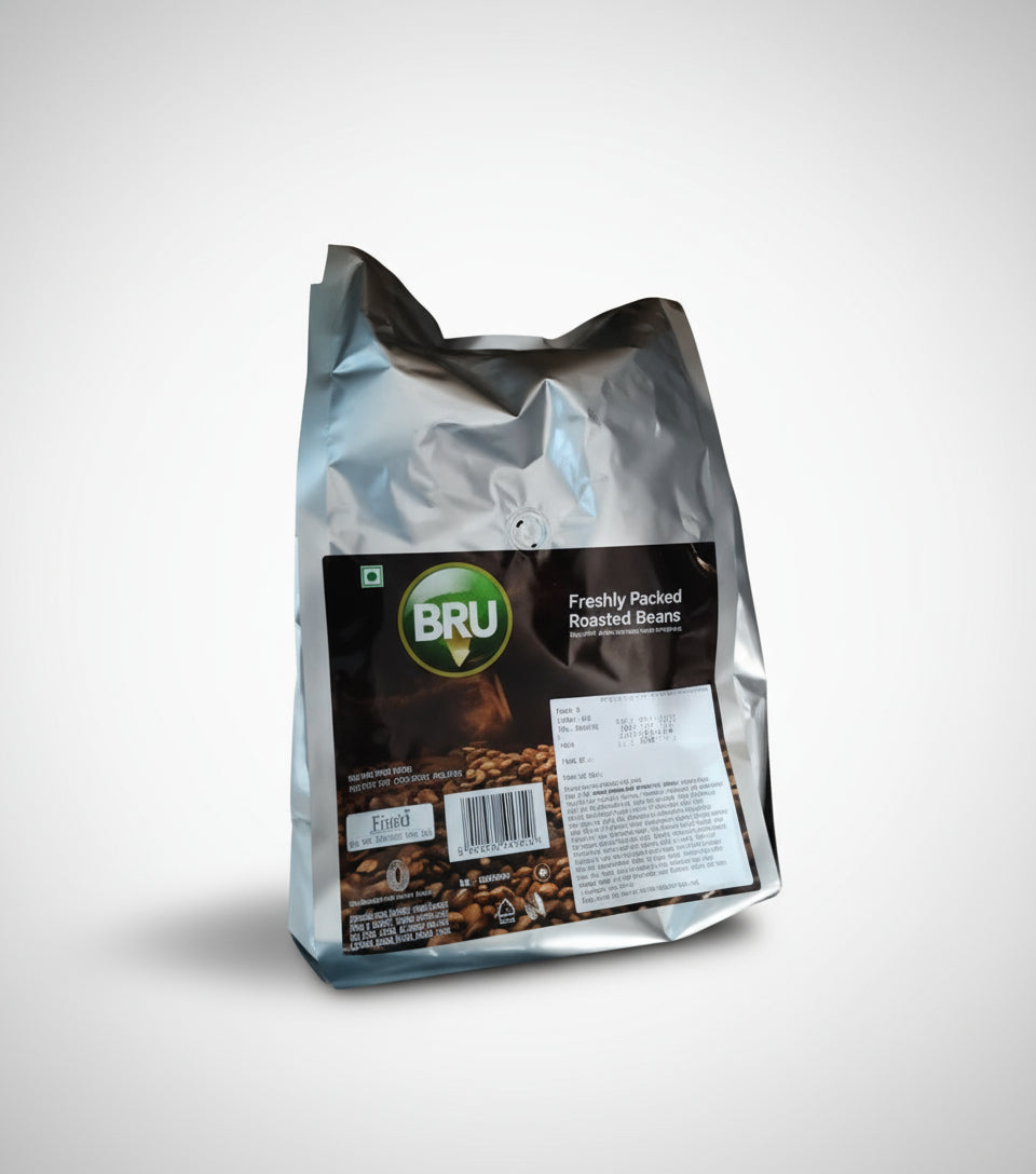 Silver foil pack of Bru Coffee Roasted Beans 1kg with fresh roasted beans branding