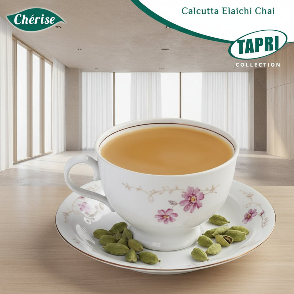 Cup of Calcutta Elaichi chai premix in floral porcelain cup with cardamom pods on saucer