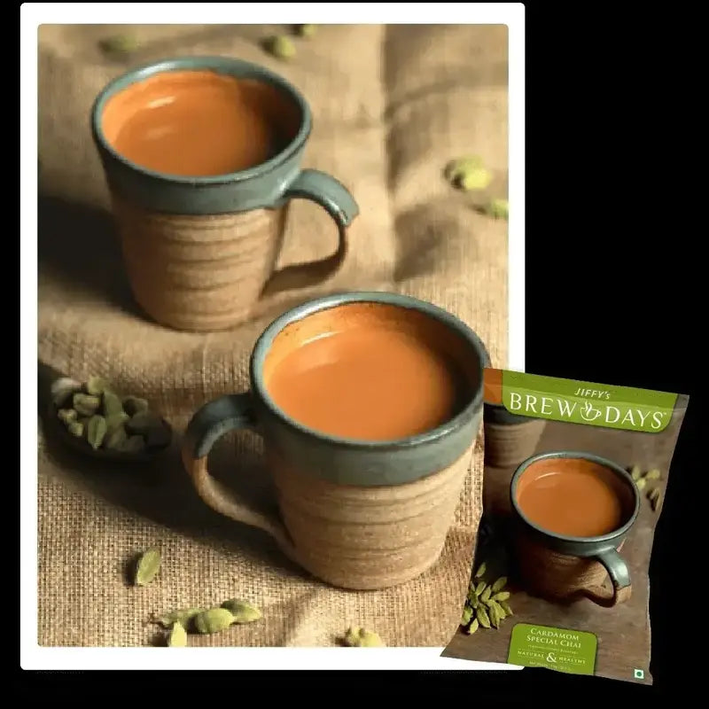 Two cups of cardamom tea premix for office with cardamom pods and Brew Days packaging