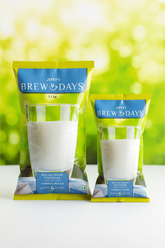 Coffee walla Jiffy's Brew Days low sugar dairy whitener in two different package sizes with a glass of milk
