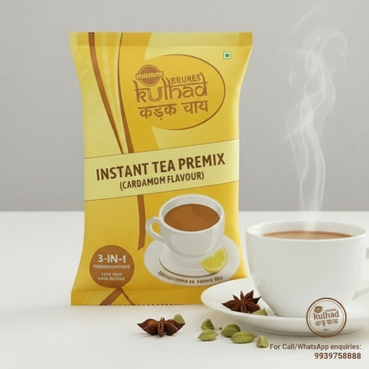 Coffee walla cardamom instant tea premix packet with steaming cup of tea and cardamom pods on white surface