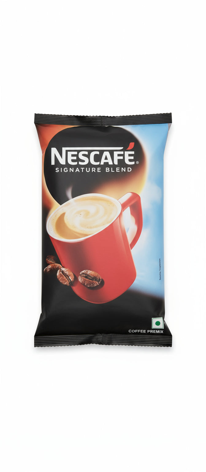 Nescafe Signature Blend coffee premix pack featuring a red cup of creamy coffee and coffee beans