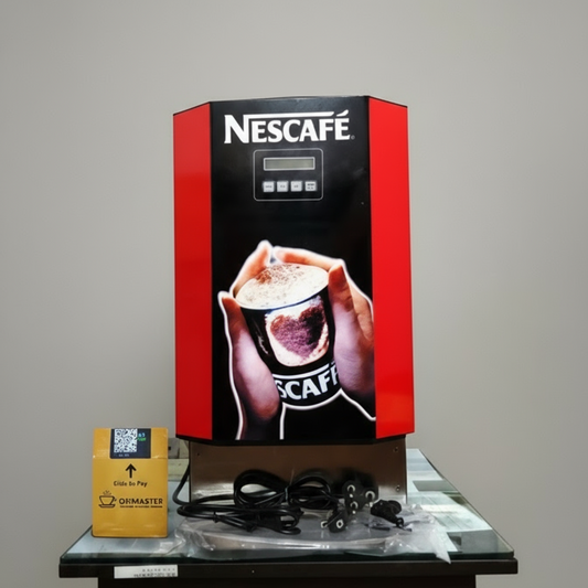 Nescafe smart coffee vending machine with red and black design on a table with accessories