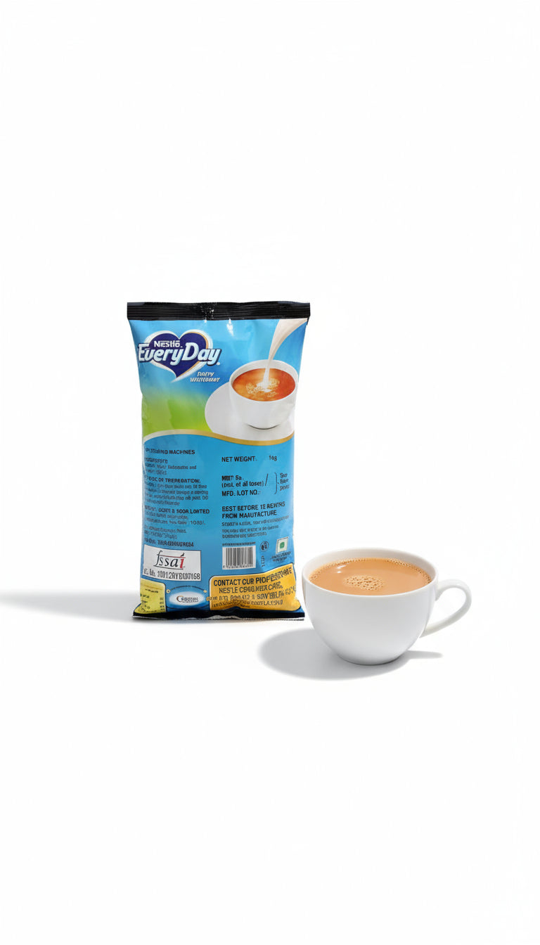 Nestle EveryDay dairy whitener 1kg pack with a white cup of coffee beside it
