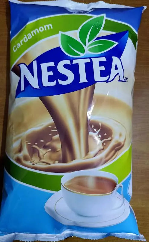 Nestea cardamom tea premix packet with cup of tea and splash design on blue and green background