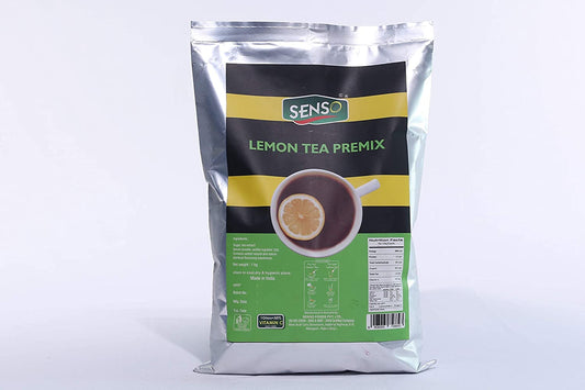 Senso lemon tea premix in silver foil packaging with green and yellow label and a cup of lemon tea image